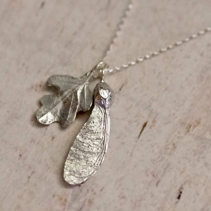 Hand crafted pewter oak leaf and sycamore key necklace on a